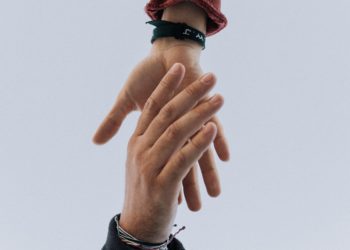 view of two persons hands