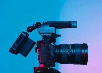 black dslr camera on green surface