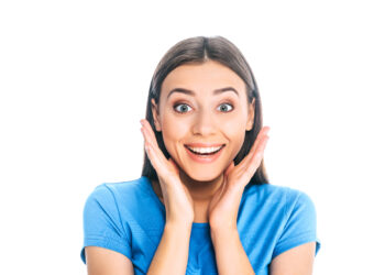 portrait of young excited woman isolated on white