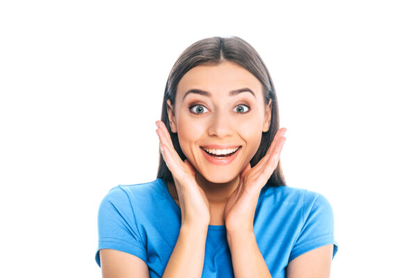 portrait of young excited woman isolated on white