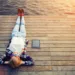 Woman relaxing upon a wooden jetty