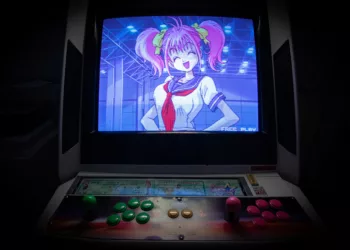 black flat screen tv turned on showing woman in blue dress